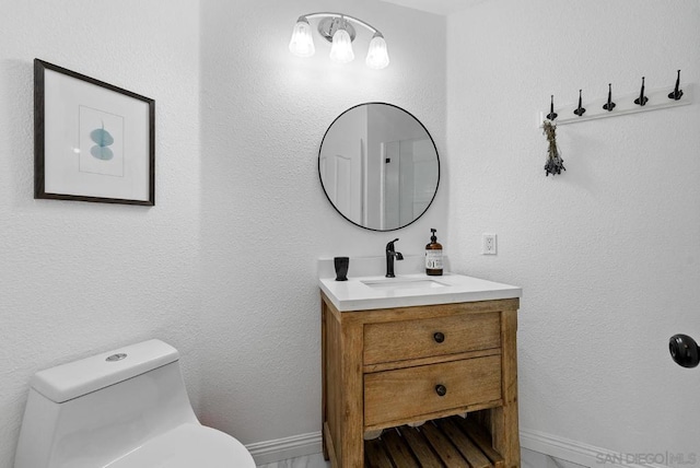 bathroom with vanity and toilet