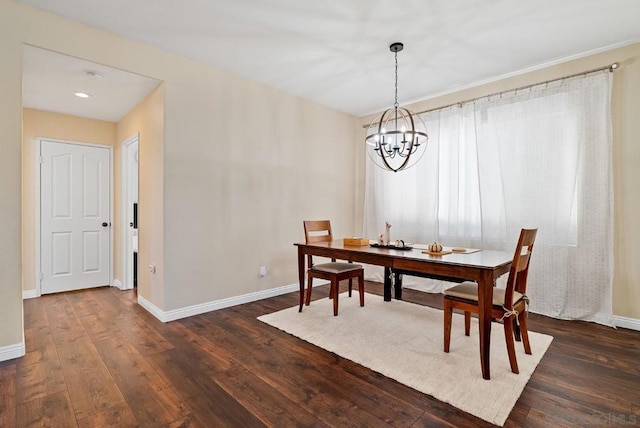 dining room featuring dark hardwood / wood-style floors and a notable chandelier