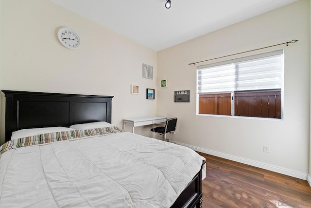 bedroom featuring dark hardwood / wood-style flooring