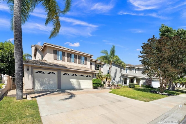 view of front facade with a garage and a front lawn