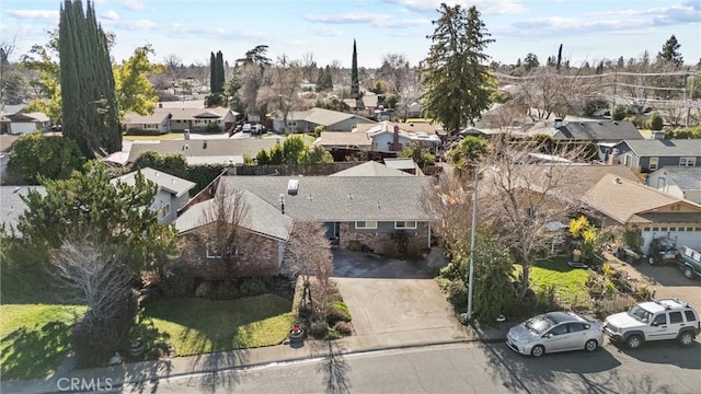 birds eye view of property with a residential view