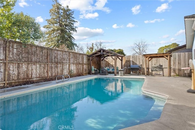 view of swimming pool featuring a gazebo and a patio area