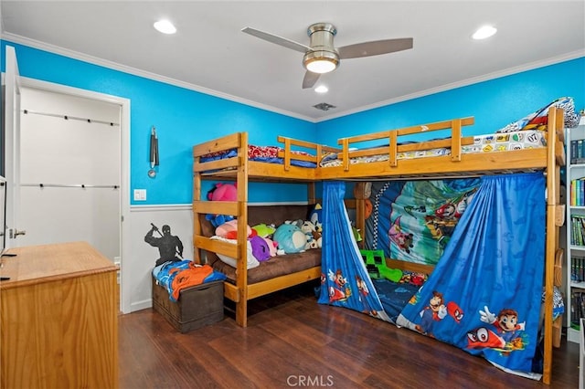 bedroom featuring ornamental molding and dark hardwood / wood-style floors