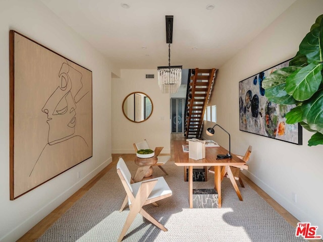 dining area featuring a notable chandelier