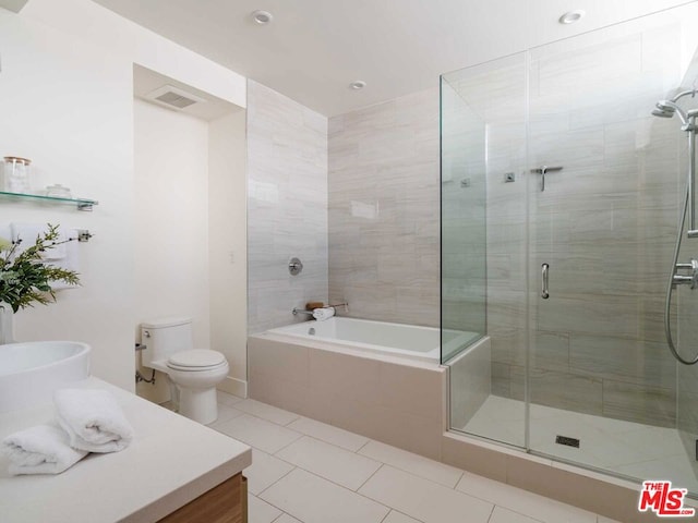 full bathroom with vanity, tile patterned floors, toilet, and separate shower and tub