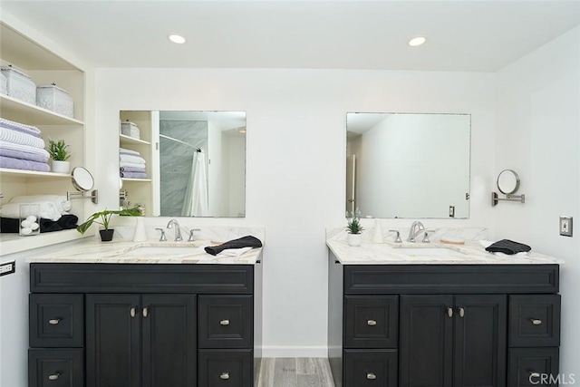 bathroom featuring vanity, hardwood / wood-style flooring, and a shower with curtain