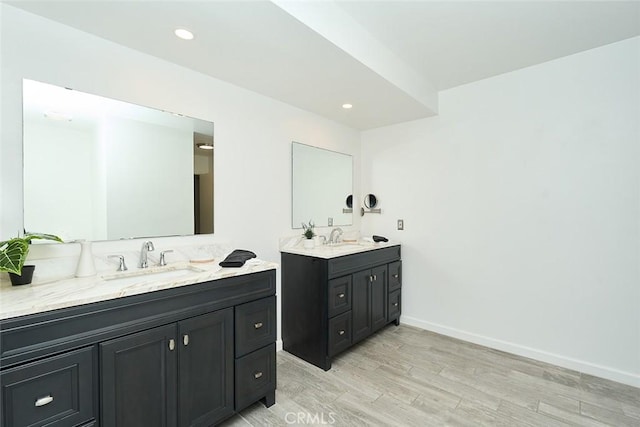 bathroom with hardwood / wood-style flooring and vanity