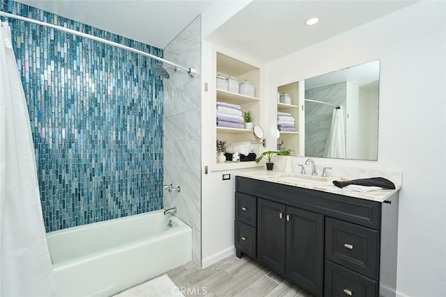 bathroom with vanity and shower / bath combo