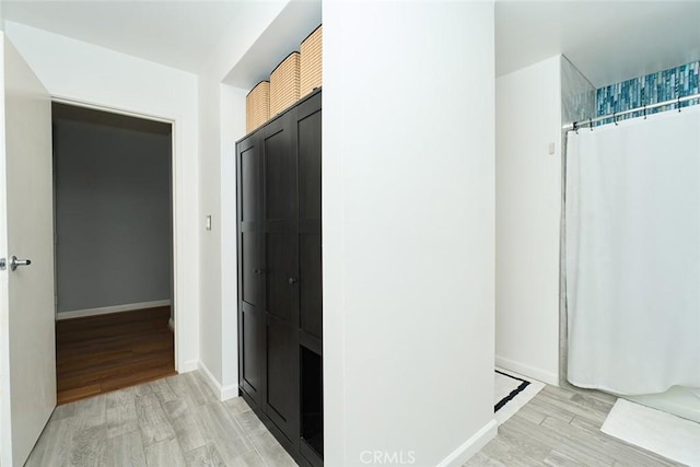 hallway featuring light hardwood / wood-style floors