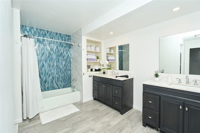 bathroom featuring vanity, shower / bathtub combination with curtain, and wood-type flooring