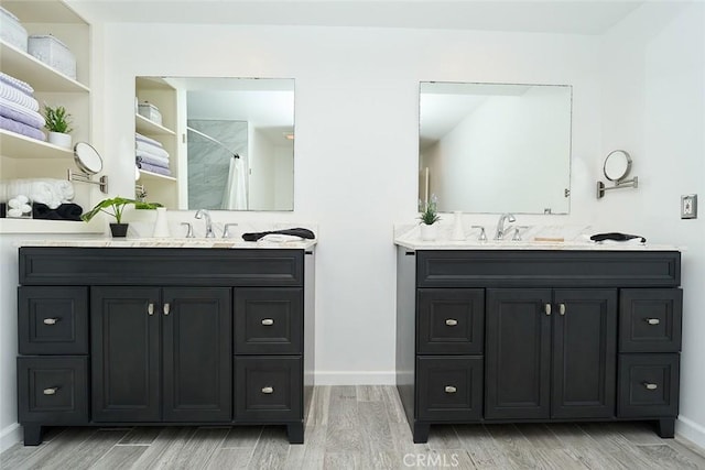 bathroom with vanity and wood-type flooring