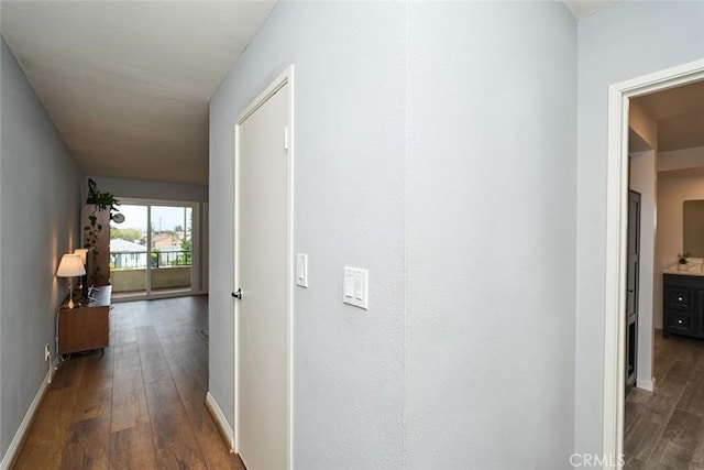 hallway featuring dark hardwood / wood-style floors