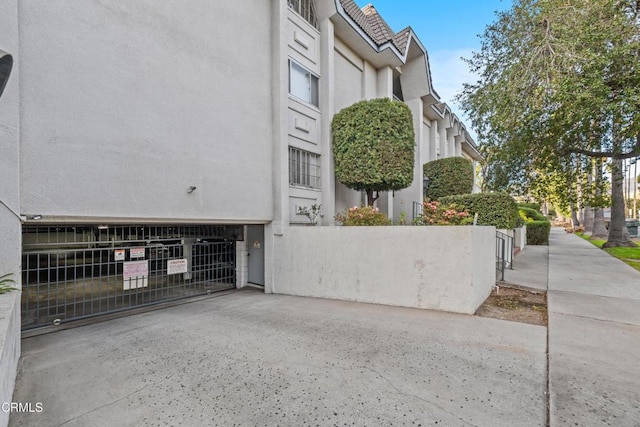 view of side of home featuring a garage