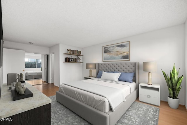 bedroom with a closet and wood finished floors
