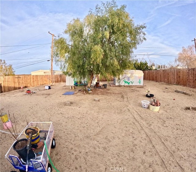 view of yard featuring a storage unit