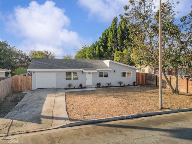 ranch-style home featuring a garage