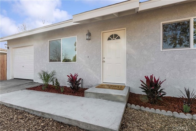 property entrance with a garage