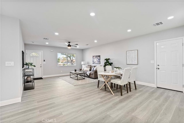 dining space featuring ceiling fan and light hardwood / wood-style flooring