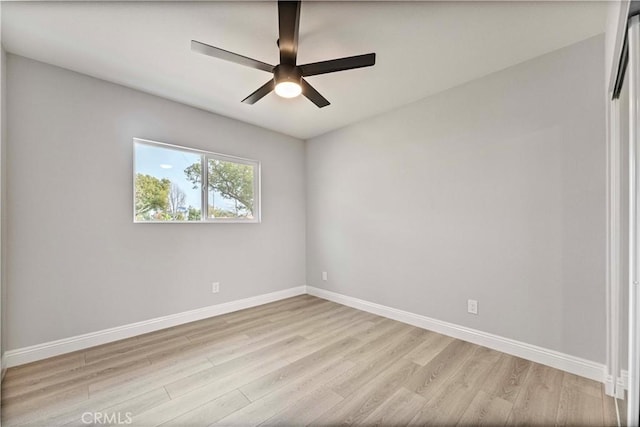 empty room with ceiling fan and light wood-type flooring