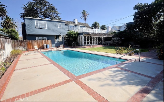 view of swimming pool with a patio