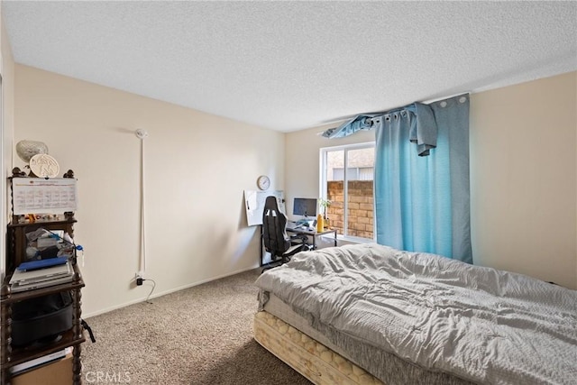 bedroom featuring carpet floors and a textured ceiling