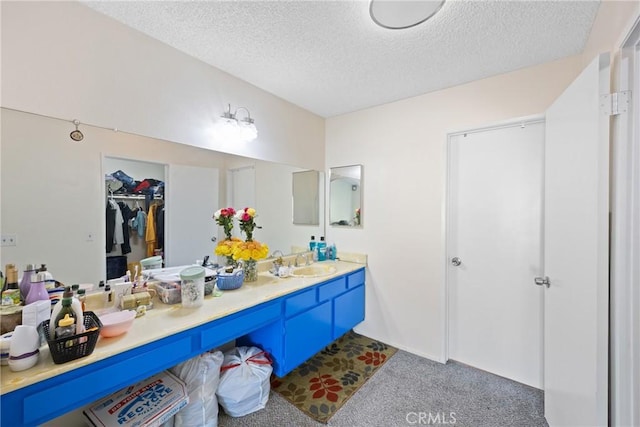 bathroom featuring vanity and a textured ceiling