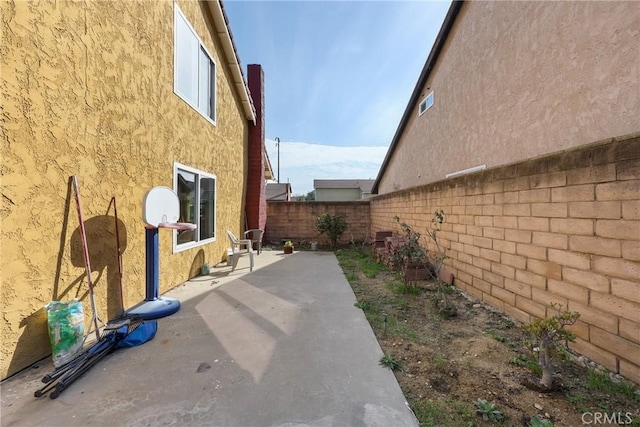 view of side of home with a patio