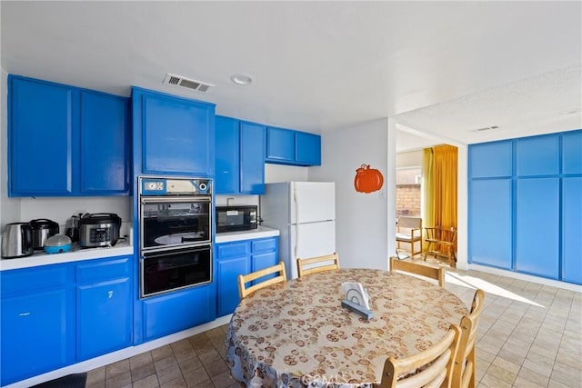 kitchen with blue cabinets and black appliances