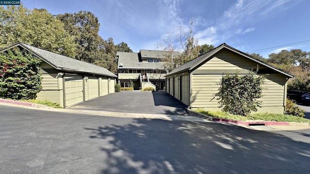 exterior space featuring an outbuilding and a garage