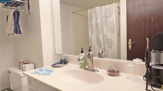 bathroom with vanity, toilet, and walk in shower