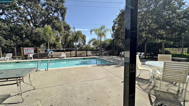 view of pool featuring a patio