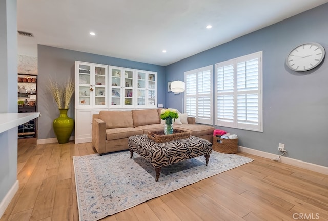 living room with light hardwood / wood-style flooring