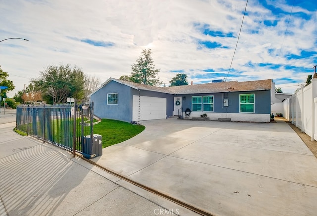 ranch-style home featuring a garage and a front lawn