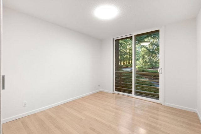 spare room with light wood-type flooring