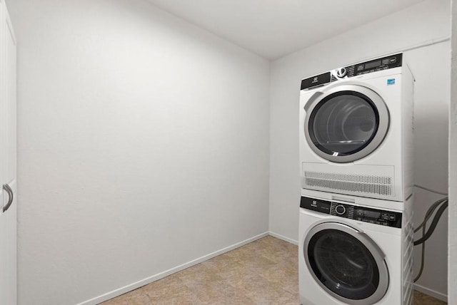 washroom with stacked washer / dryer