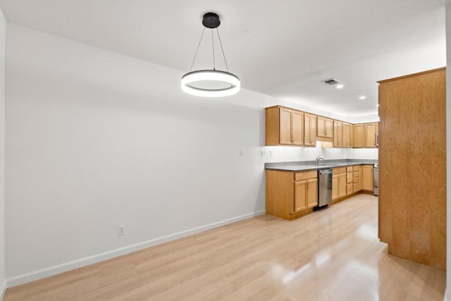 kitchen with pendant lighting, sink, light hardwood / wood-style flooring, and stainless steel dishwasher