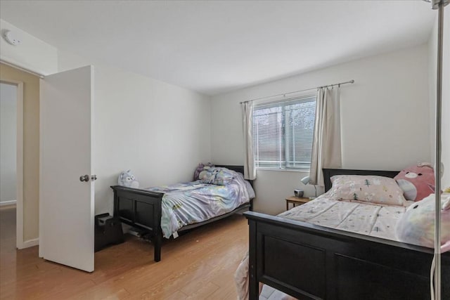 bedroom with light hardwood / wood-style flooring