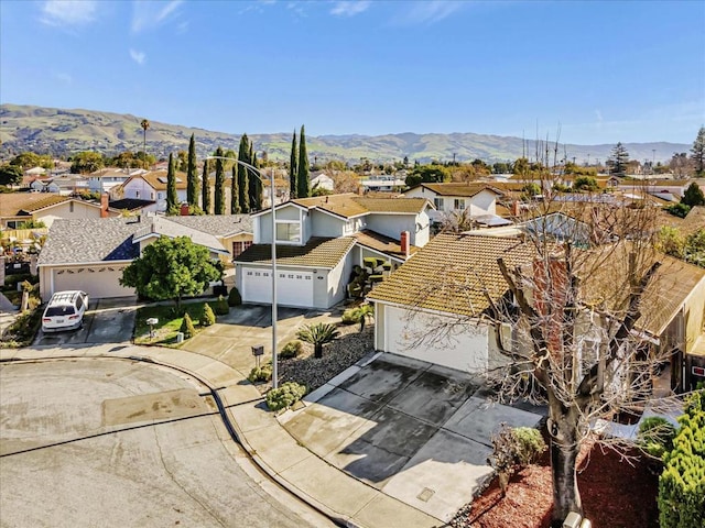 drone / aerial view featuring a mountain view