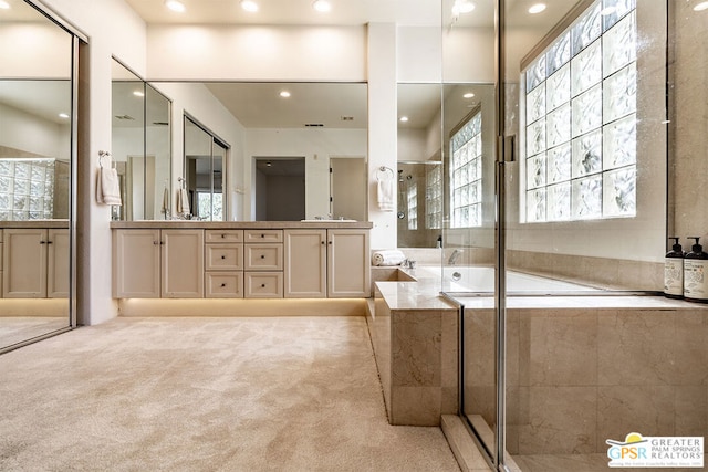 bathroom with vanity and plus walk in shower