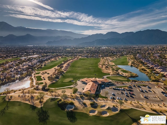 drone / aerial view with a water and mountain view