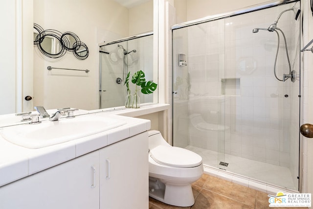 bathroom with walk in shower, vanity, and toilet