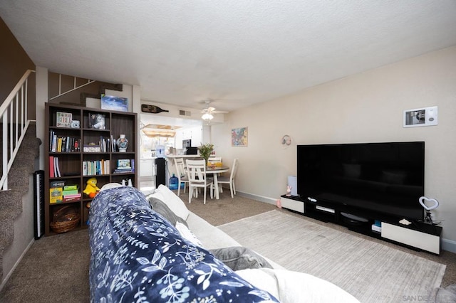 living room with carpet and ceiling fan