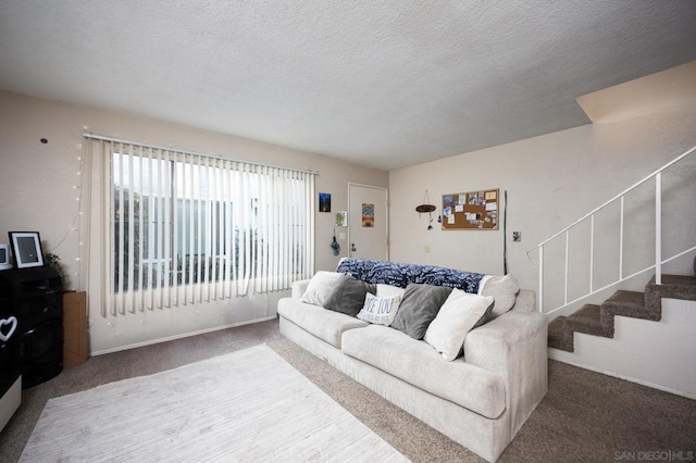 living room with carpet flooring and a textured ceiling