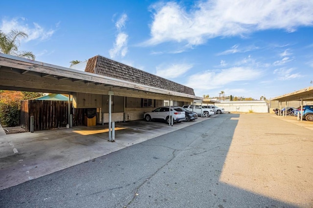 view of vehicle parking with a carport