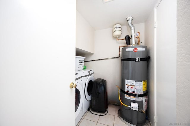 laundry room featuring separate washer and dryer, light tile patterned floors, and water heater