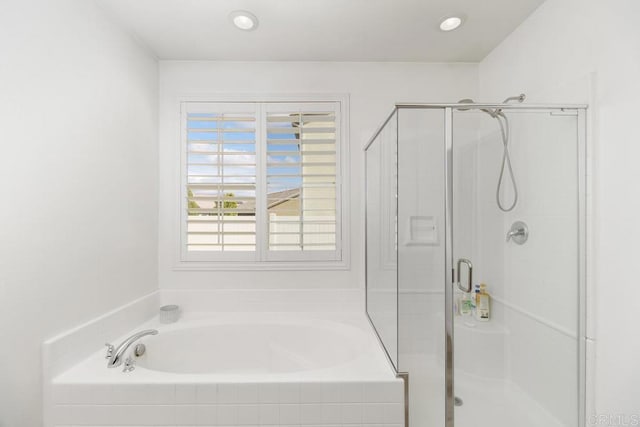 bathroom with shower with separate bathtub