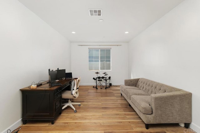 office with wood-type flooring