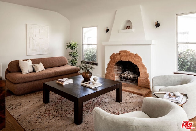 living room featuring a fireplace