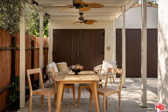 view of patio featuring ceiling fan