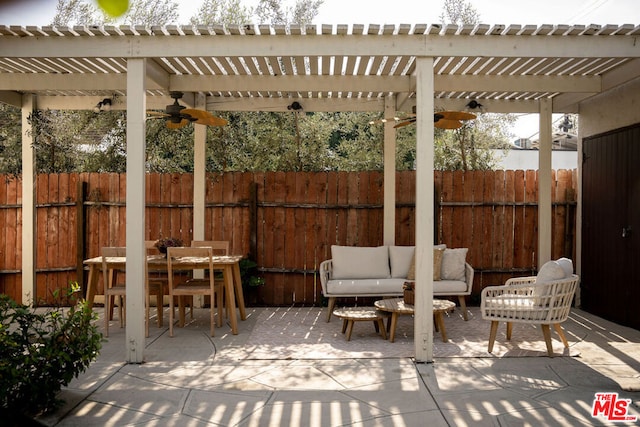 view of patio / terrace with ceiling fan, an outdoor hangout area, and a pergola